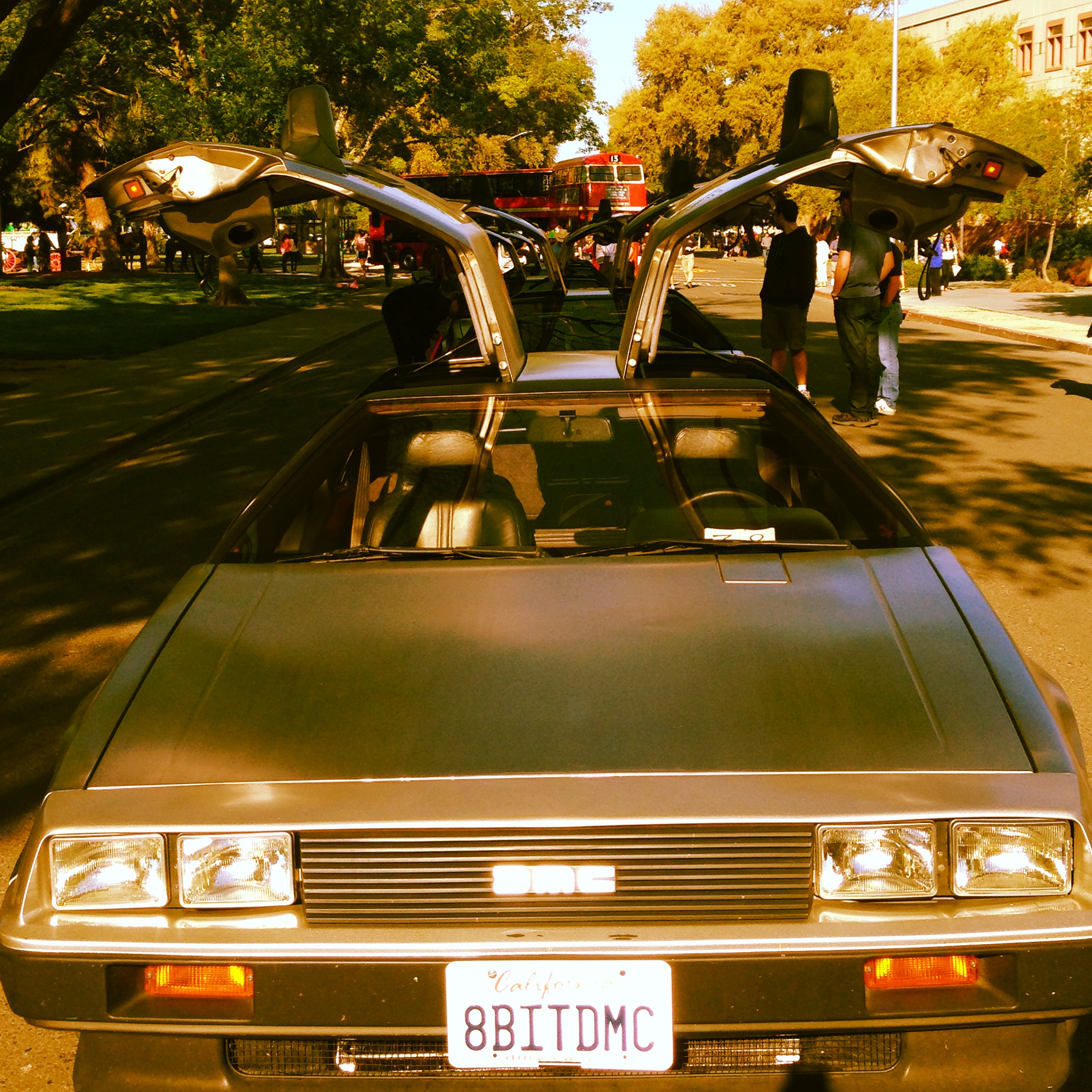 a sepia toned photo of 8bit, the 1981 delorean car